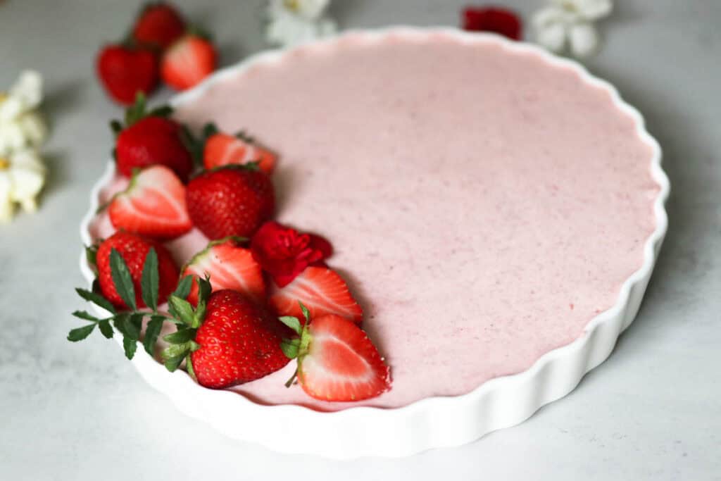 strawberry mousse with berries and flowers