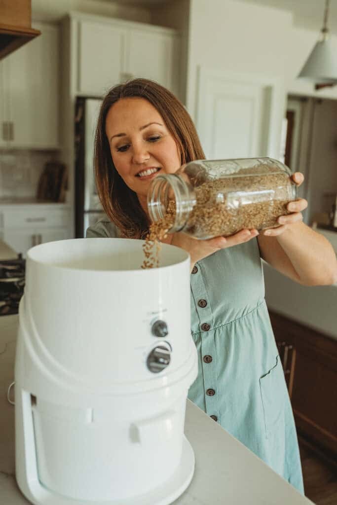 classic grain mill with kristin pouring grains in