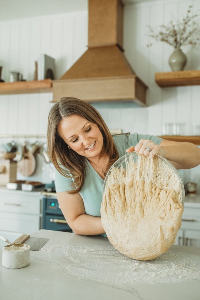 fresh milled flour pouring out of bowl waiting to be shaped