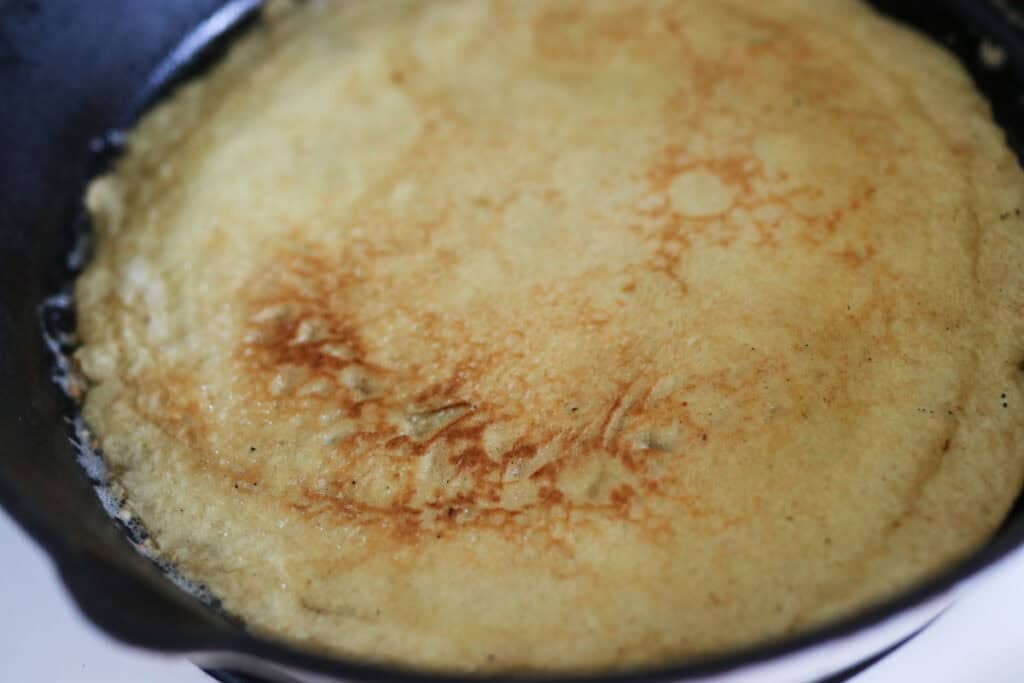 crepe cooking in a pan