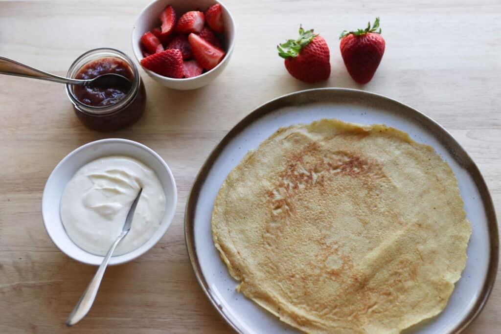 crepes with strawberries and whipped cream