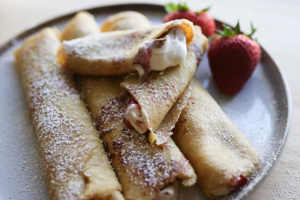 fresh milled crepes with strawberry on a plate