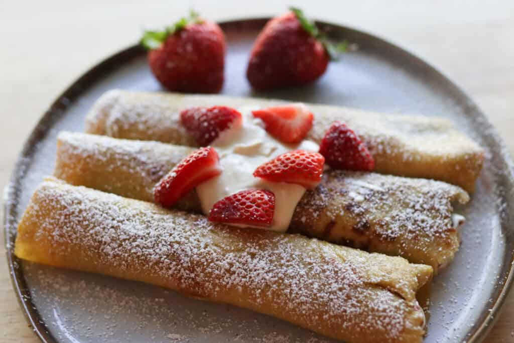 crepes sprinkled with powdered sugar