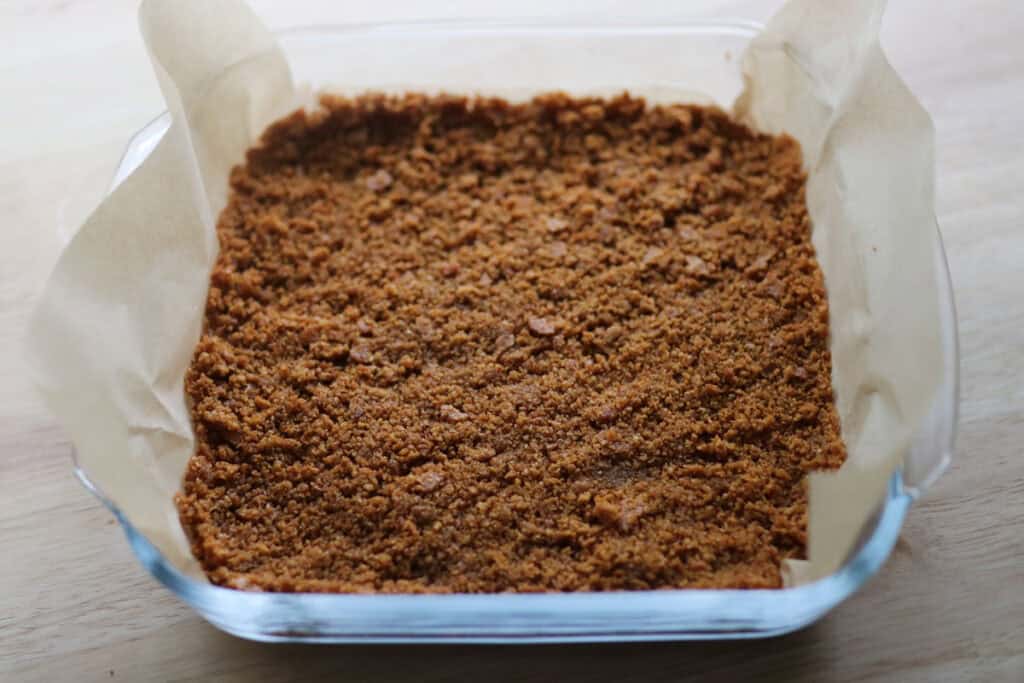 freshly milled graham crackers pressed into a pan