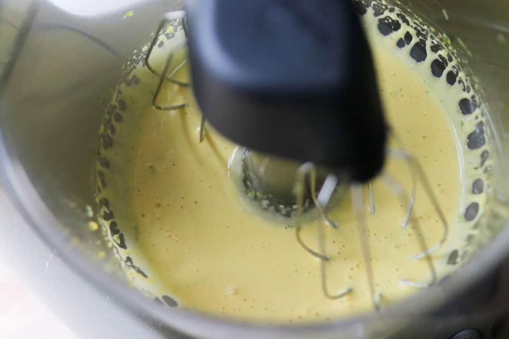 egg yolks and lime zest that have been whisked to put in the freshly milled key lime pie bars