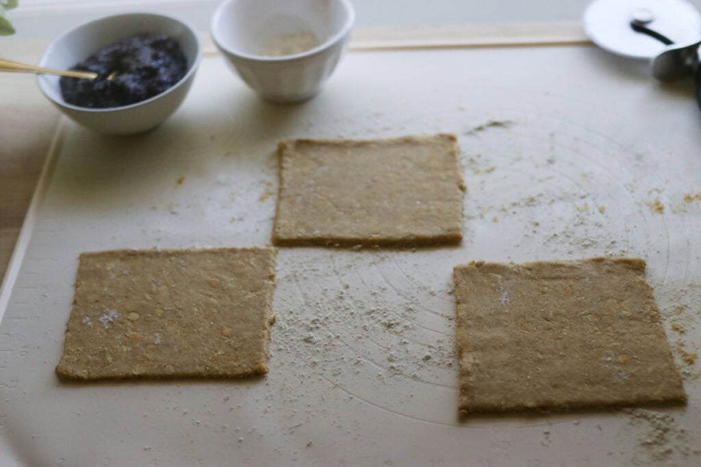 Dough that has been cut into squares to make nutrigrain bars