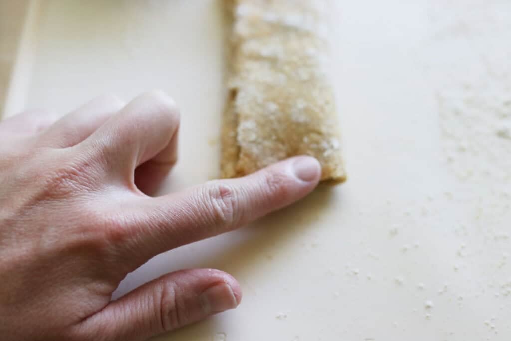 a freshly milled nutrigrain bar that has the edges pinched together