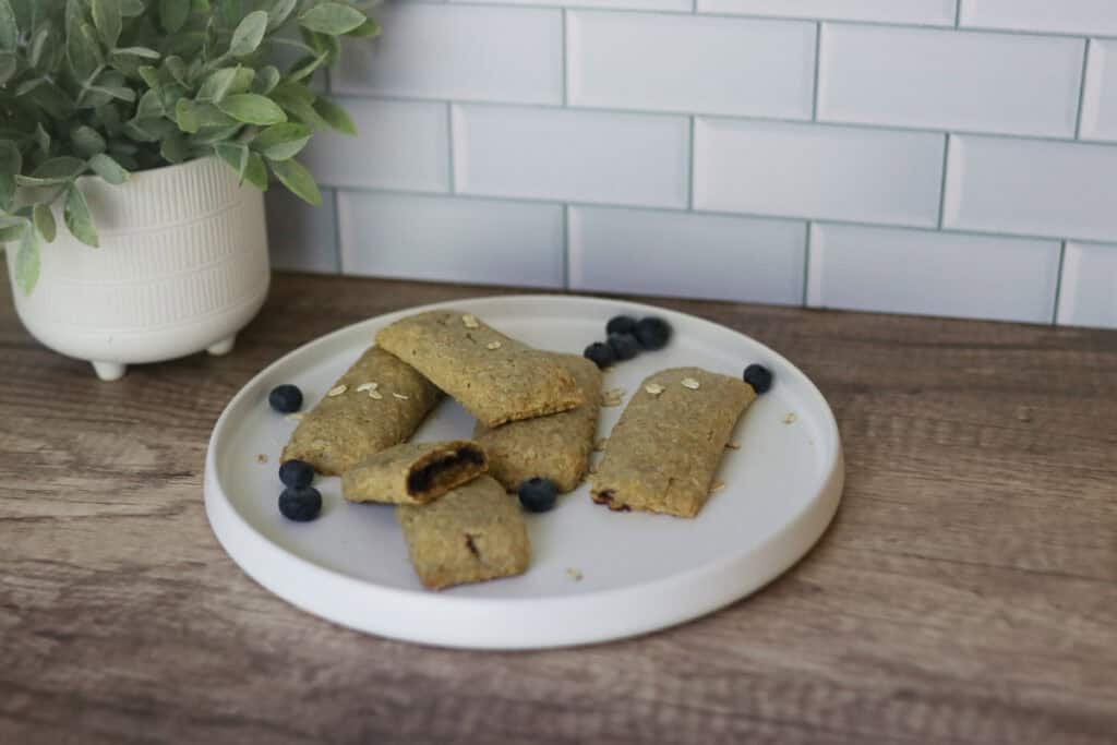 freshly milled nutrigrain bars with blueberries on a plate