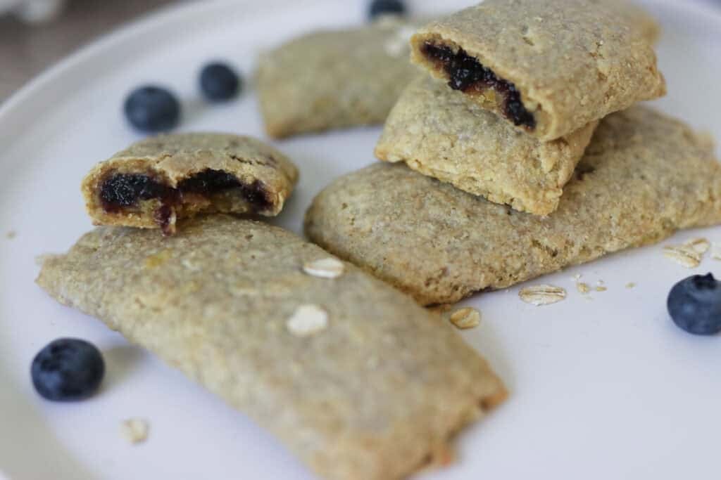 a close up of freshly milled nutrigrain bars on a white plate