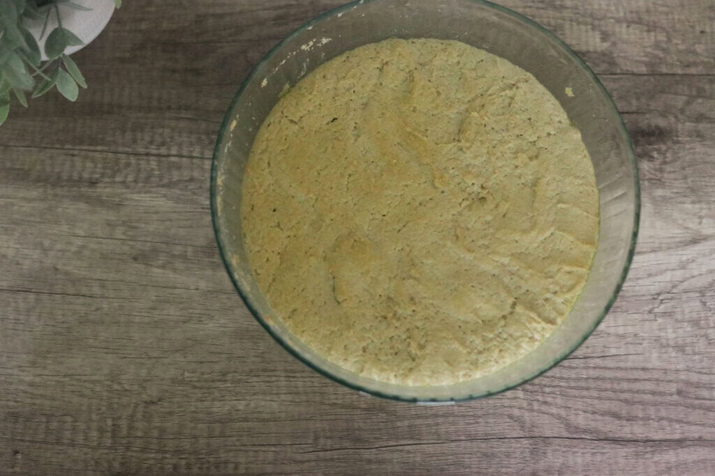 sourdough that has risen in glass bowl