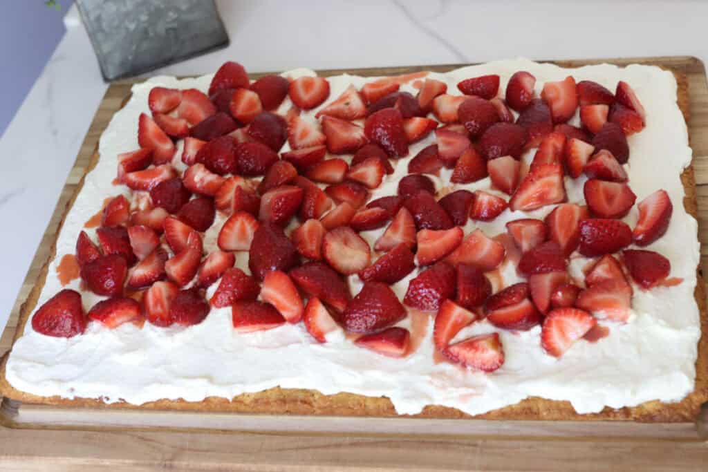 sheet pan strawberry shortcake on a cutting board