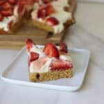 a piece of freshly milled strawberry shortcake sitting on plate
