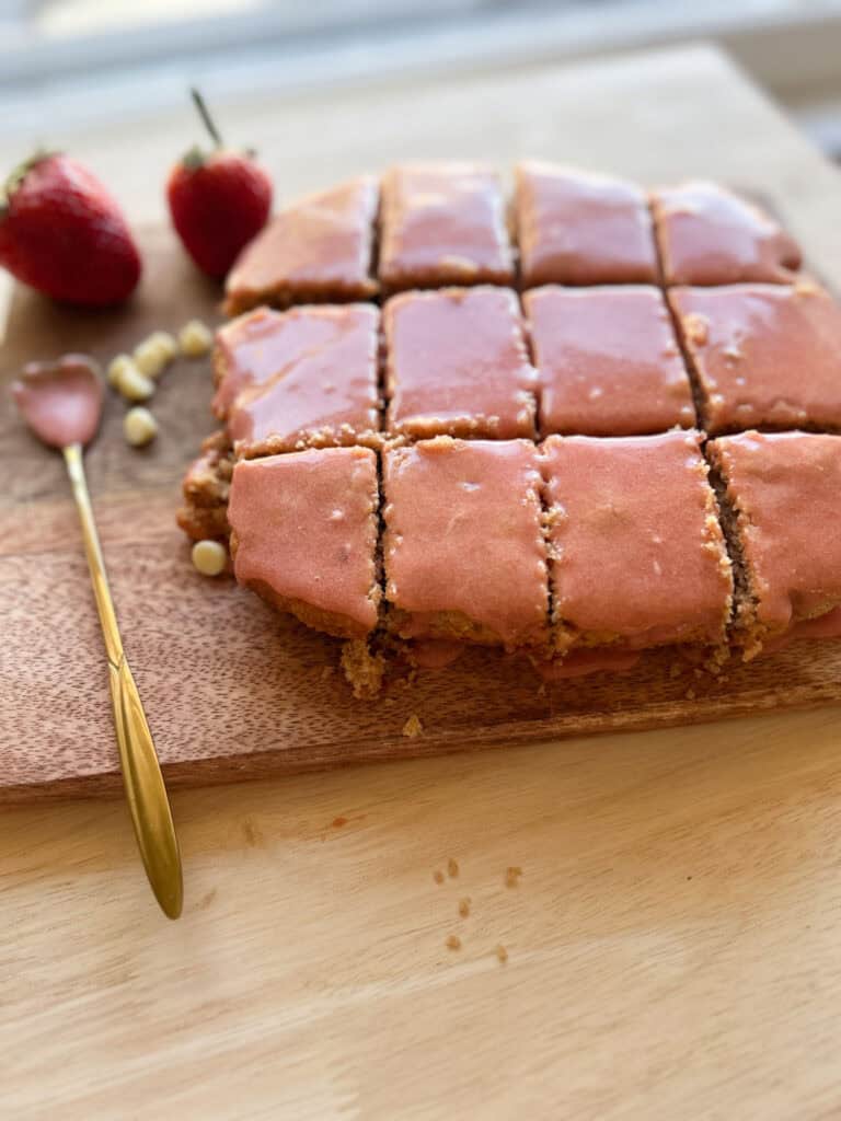 strawberry brownies with fresh milled flour and spoon with icing on it