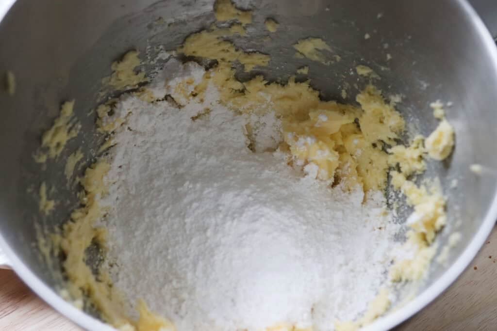 butter and powdered sugar in a mixing bowl
