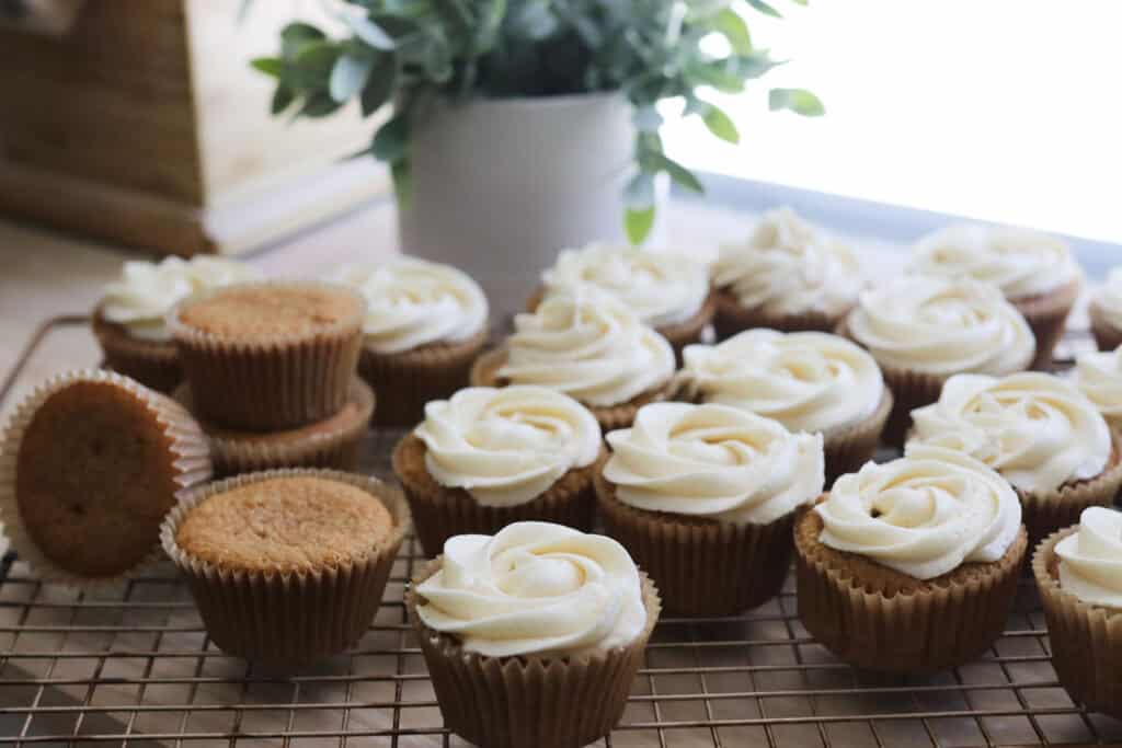 fresh milled cupcakes with buttercream on a wire rack