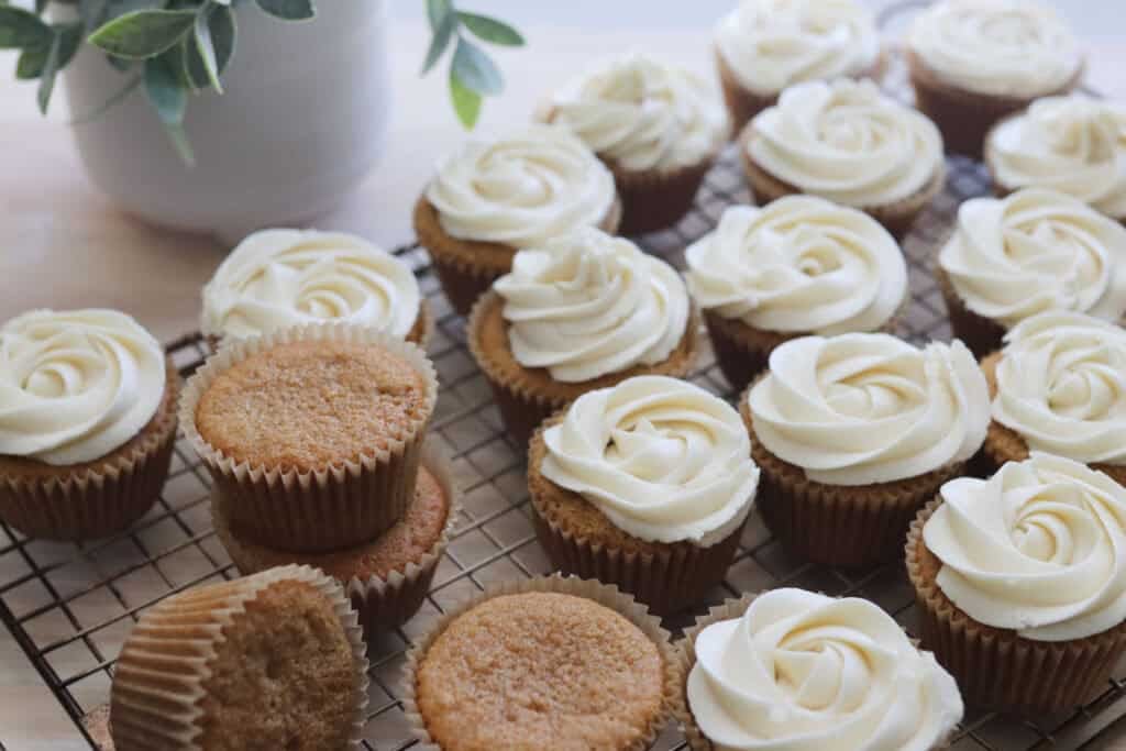 vanilla cupcakes on a wire rack