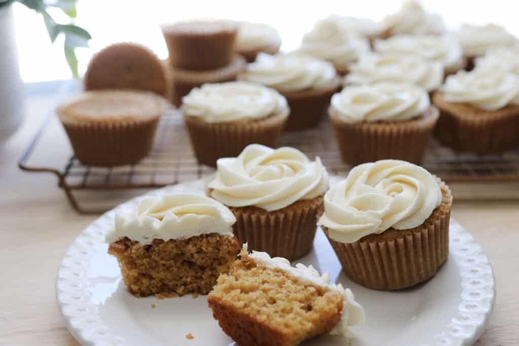 fresh milled cupcakes on a plate with more cupcakes in the background