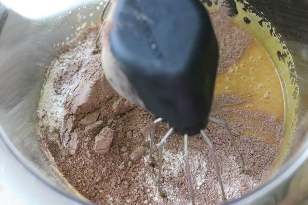 mixing the ingredients for the fresh. milled hostess sheet cake