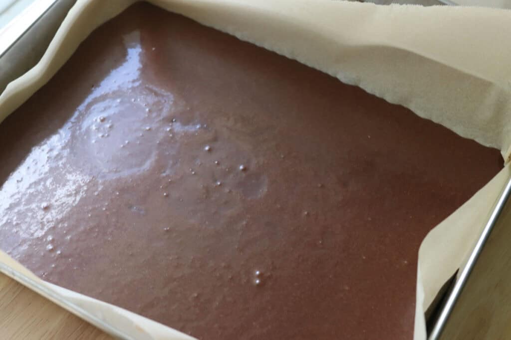fresh milled hostess sheet cake batter poured into a baking pan