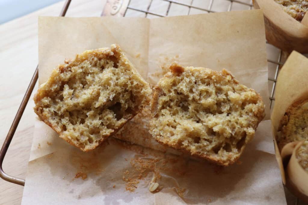 a fresh milled sourdough banana crumble muffin that has been cut in half