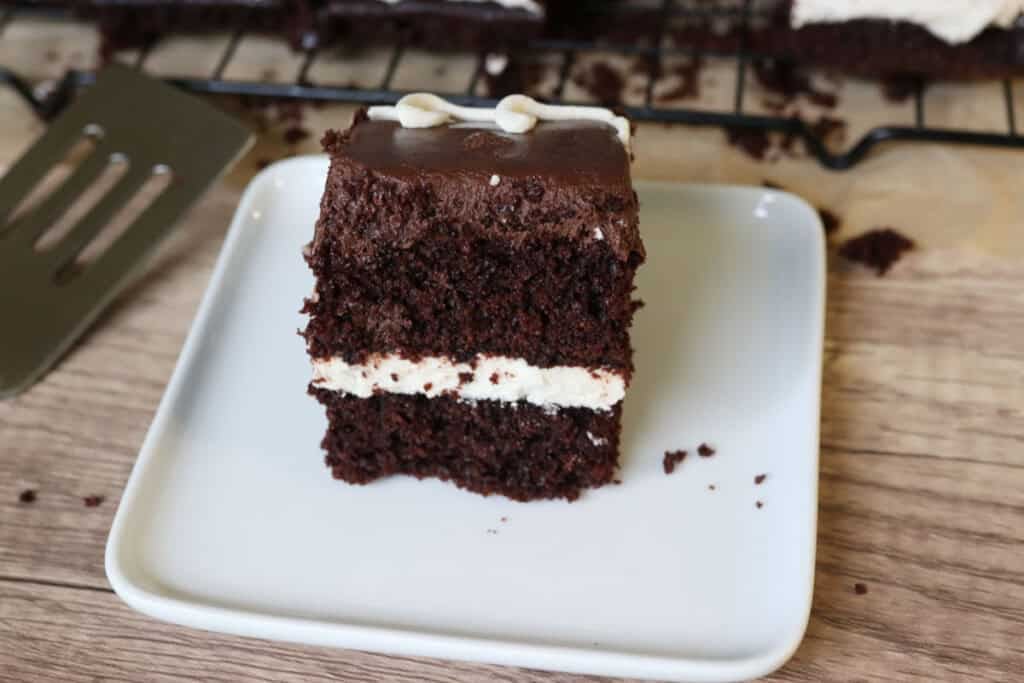 a slice of fresh milled hostess sheet cake on a white plate