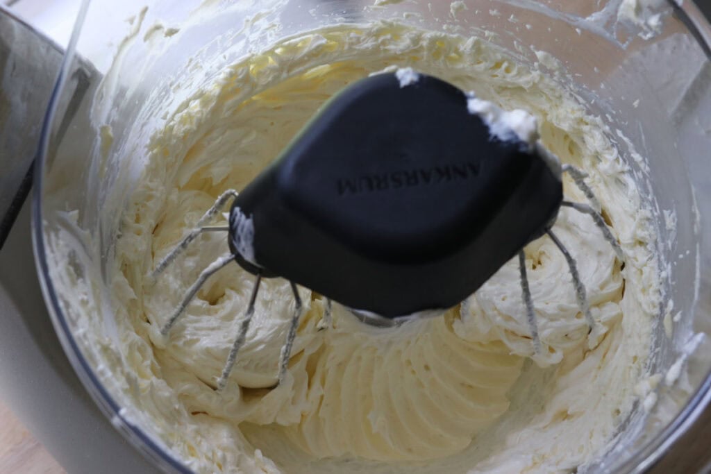 butter and powdered sugar being whipped for the freshly milled lemon chantilly cake