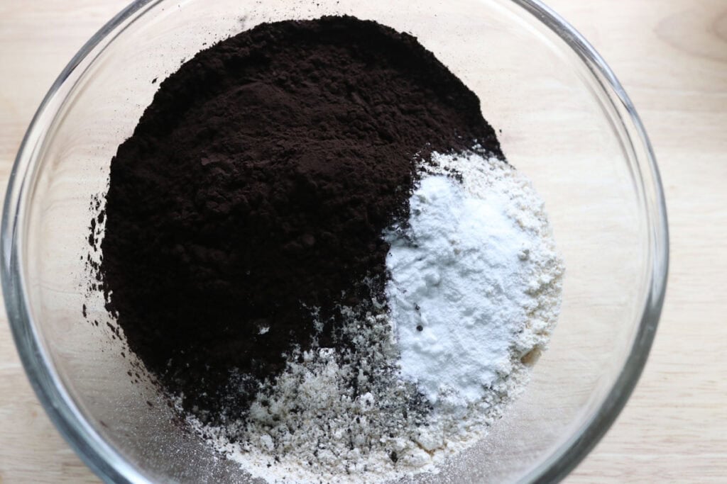 flour and cocoa powder in a glass bowl to make fresh milled homemade oreos