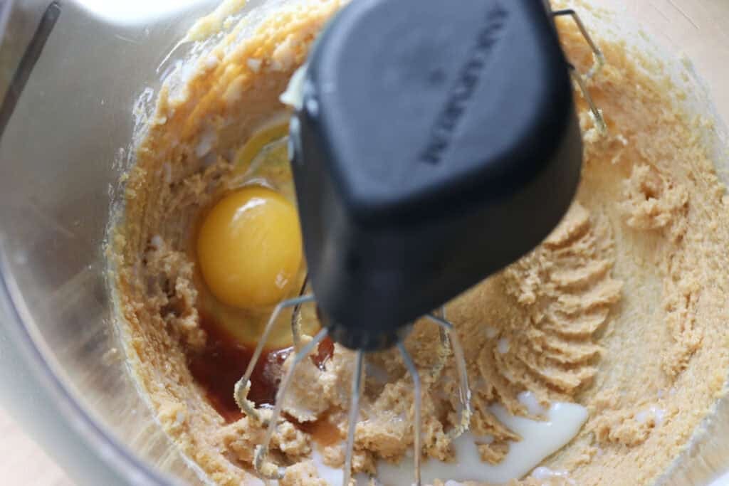 eggs, milk, and vanilla in a mixing bowl to make fresh milled homemade oreos
