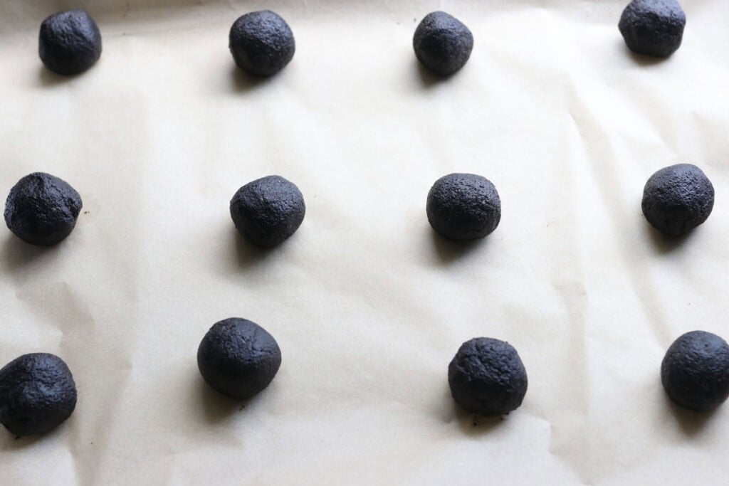 fresh milled homemade oreo dough rolled into balls 