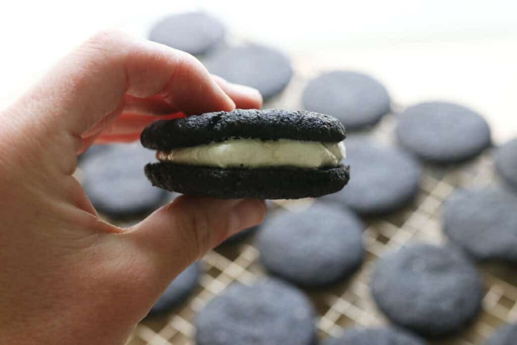 a fresh milled homemade oreo with homemade oreo cookie in the background