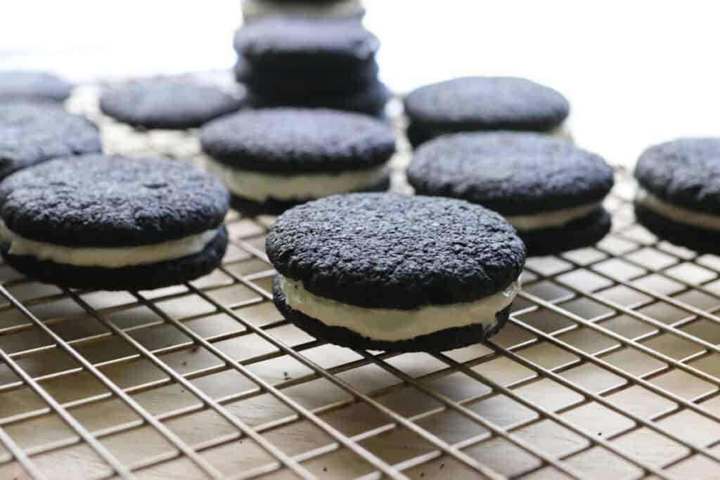fresh milled homemade oreos on a wire rack