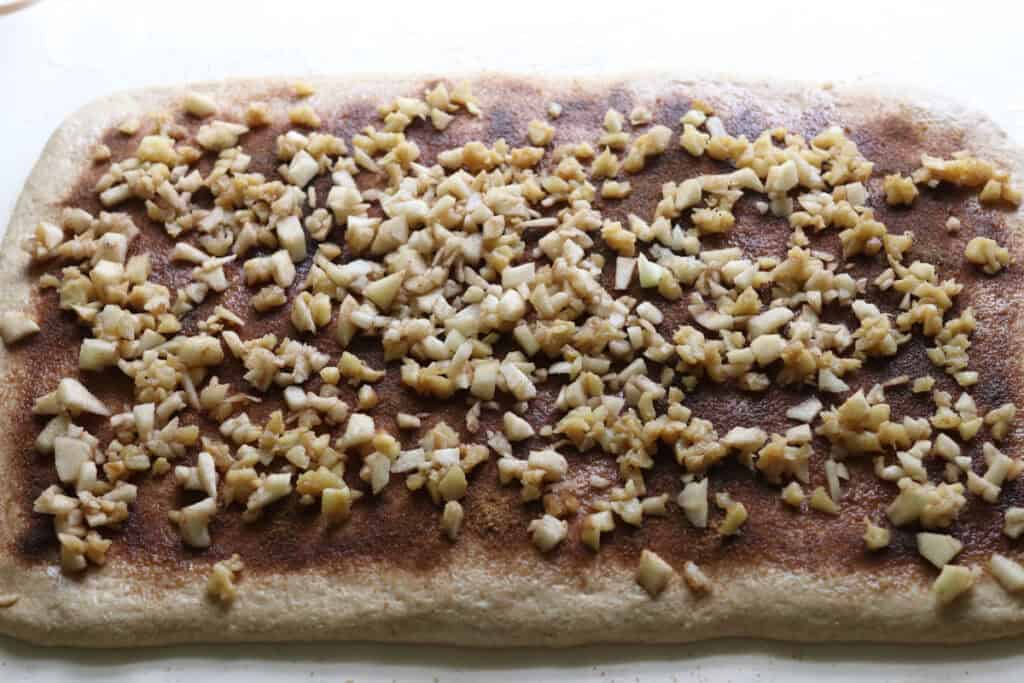 fresh milled twisted apple cinnamon dough with cinnamon, sugar, and diced apples