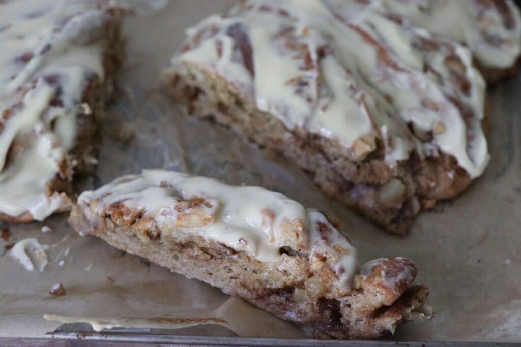 fresh milled twisted apple cinnamon loaf with icing and cinnamon on top
