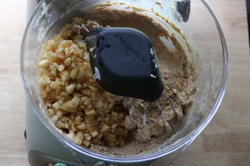 chopped apples in a mixing bowl for freshly milled apple cinnamon streusel muffins