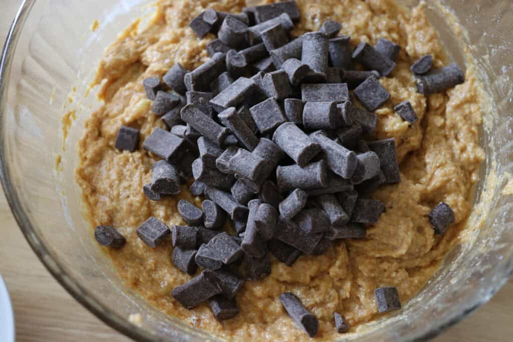 chocolate chips on top of the batter for fresh milled pumpkin chocolate chip banana bread