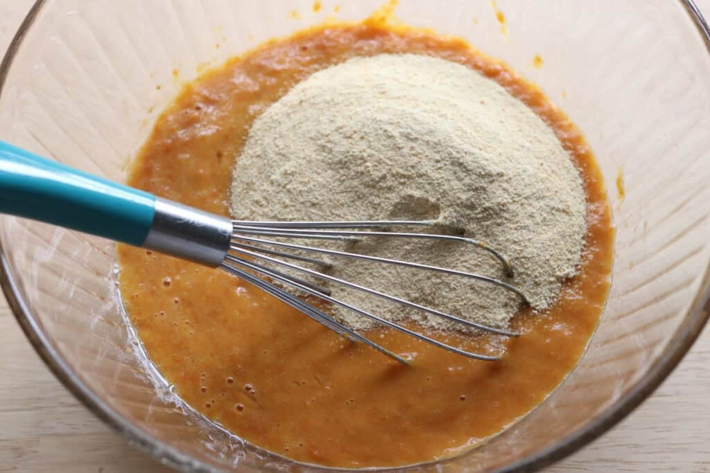 adding sugar to the batter for fresh milled cinnamon sugar pumpkin cake donuts