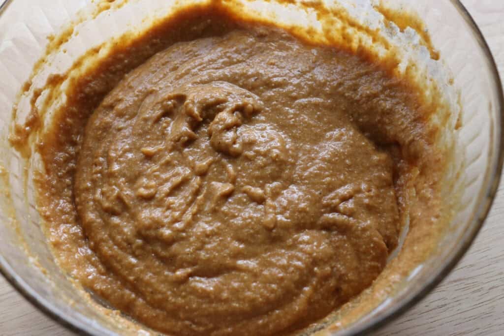 fresh milled cinnamon sugar pumpkin cake donut batter in a glass bowl