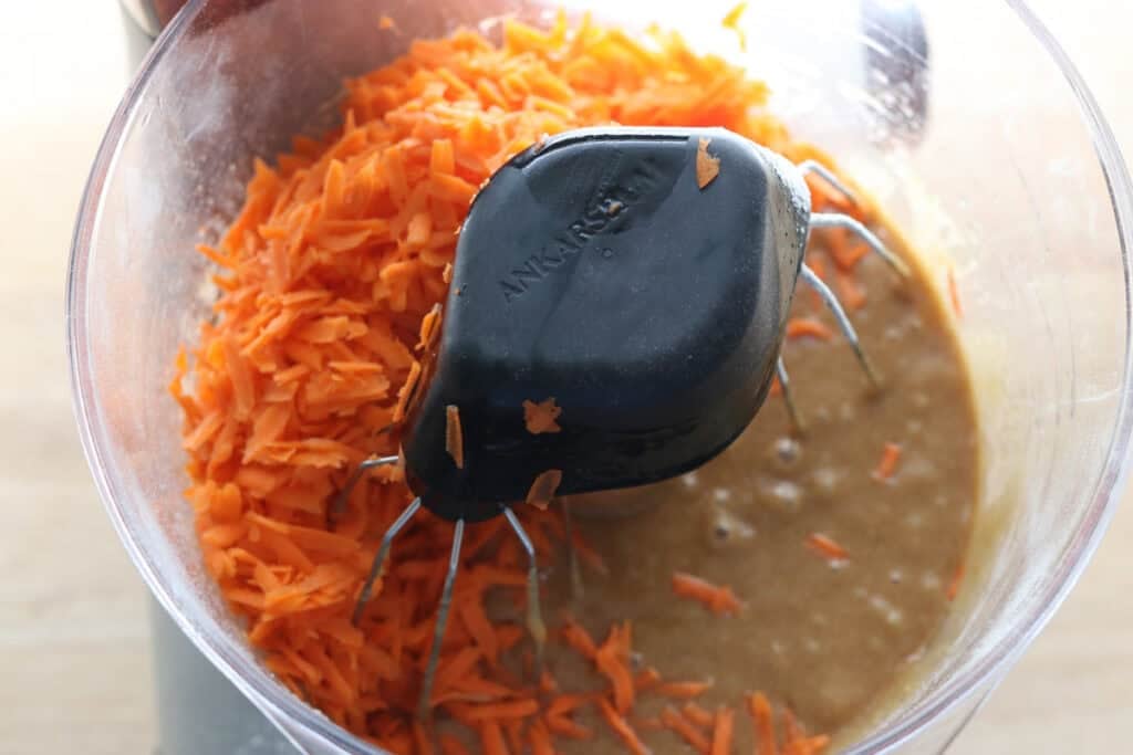 shredded carrots in cake batter for freshly milled carrot cake with cream cheese icing