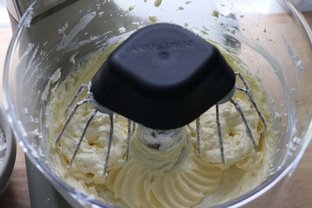 cream cheese icing in a mixing bowl for freshly milled carrot cake with cream cheese icing