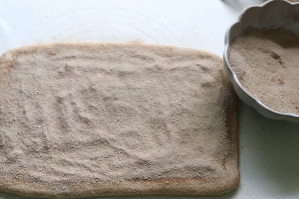 cinnamon sugar on to the dough for cinnamon swirl bread
