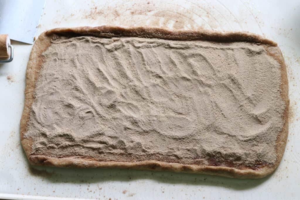 cinnamon swirl dough with the edges tucked inward