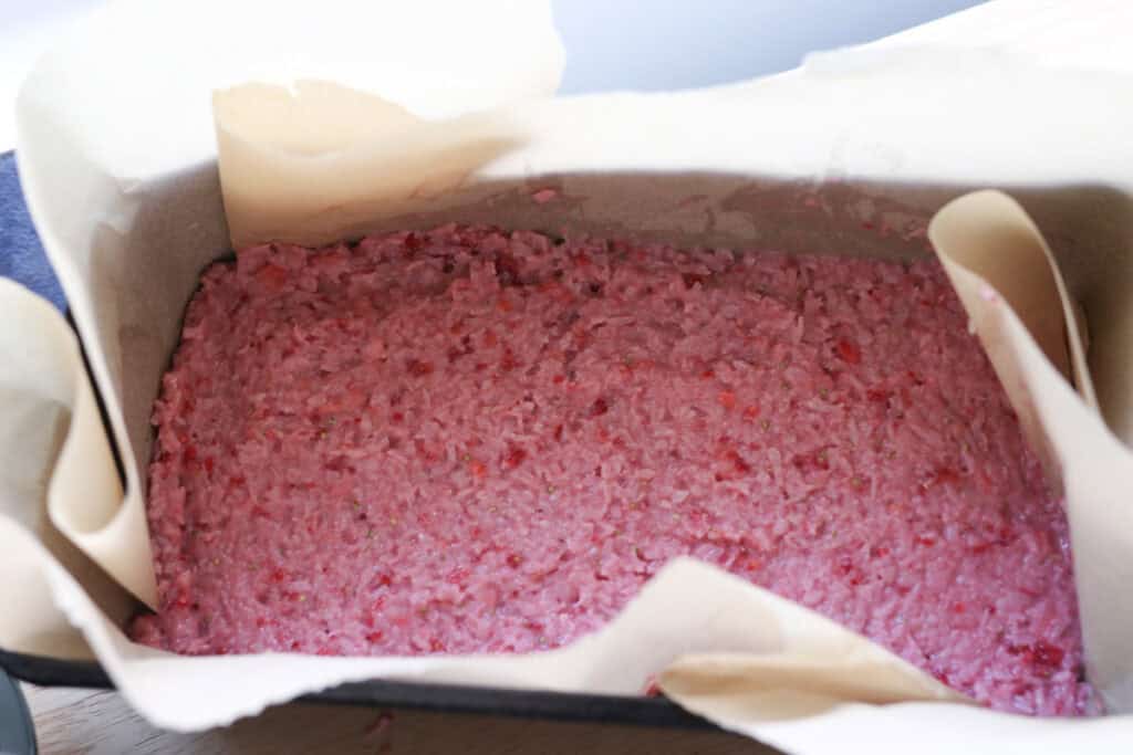 chocolate covered strawberries & cream coconut bar filling in a loaf pan