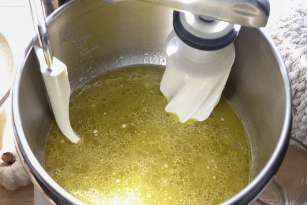 water, salt, oil, and honey in a mixing bowl to make freshly milled cinnamon rolls