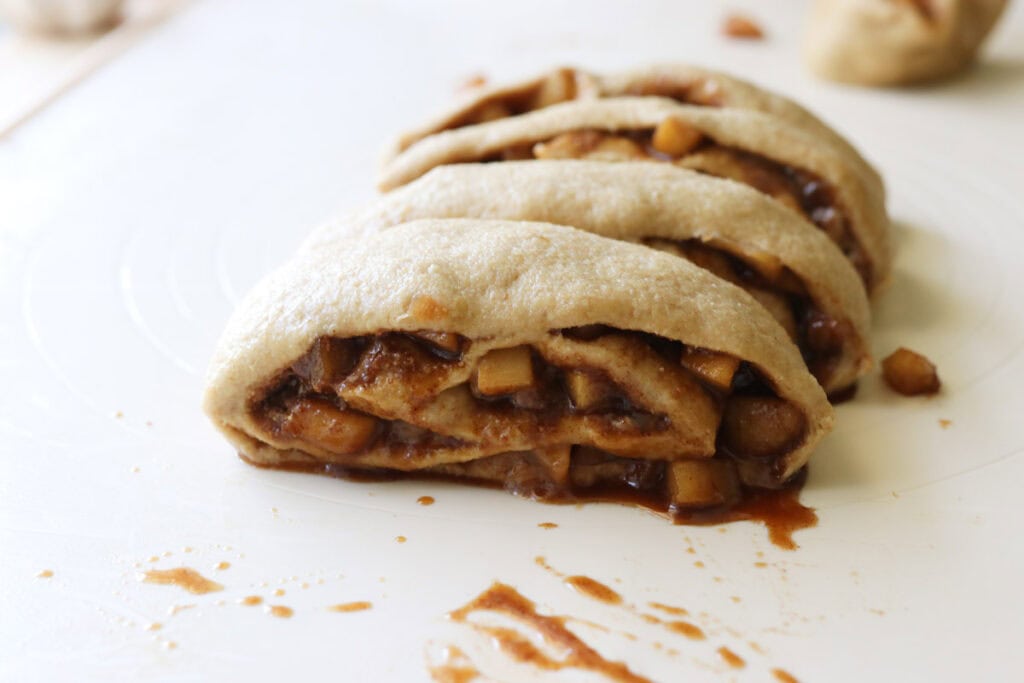  freshly milled apple cinnamon rolls that have been sliced