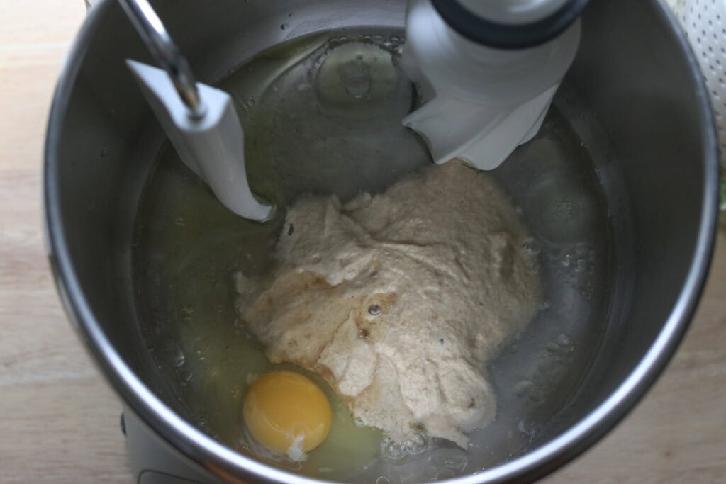 sourdough, egg, and oil in a mixing bowl to make Super Soft Freshly Milled Sourdough Sandwich Bread