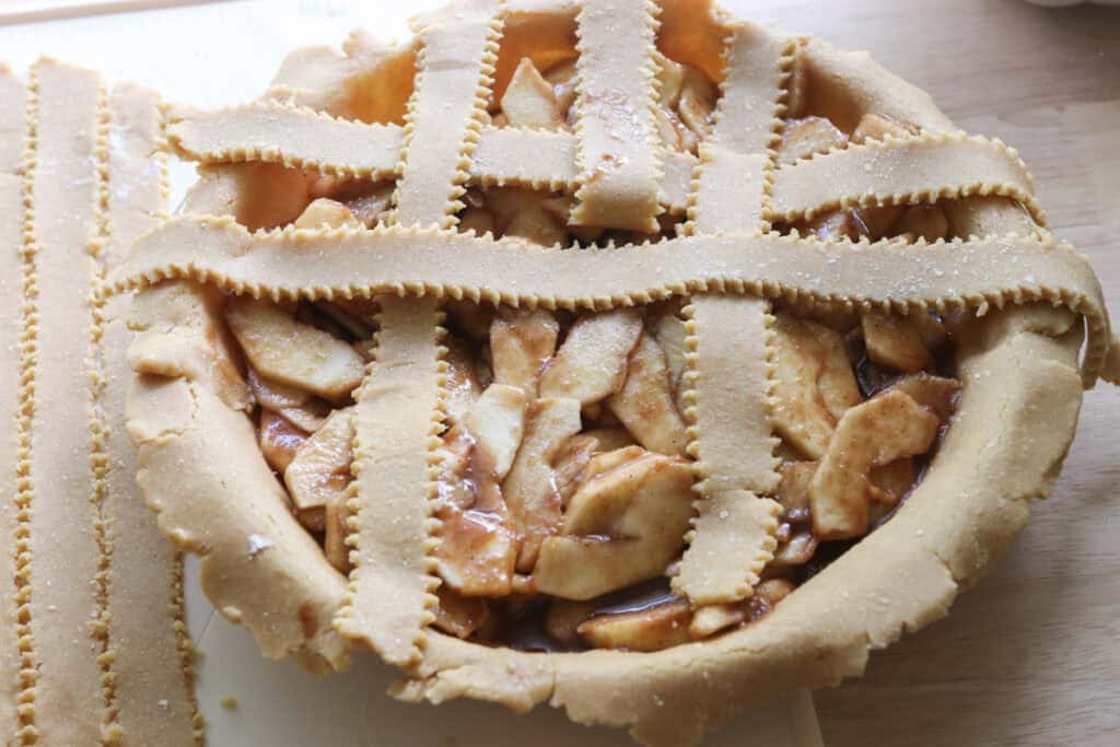 freshly milled classic apple pie with lattice strips over top of it