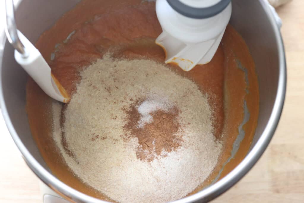 pumpkin puree and flour in a mixing bowl to make fresh milled pumpkin monkey bread