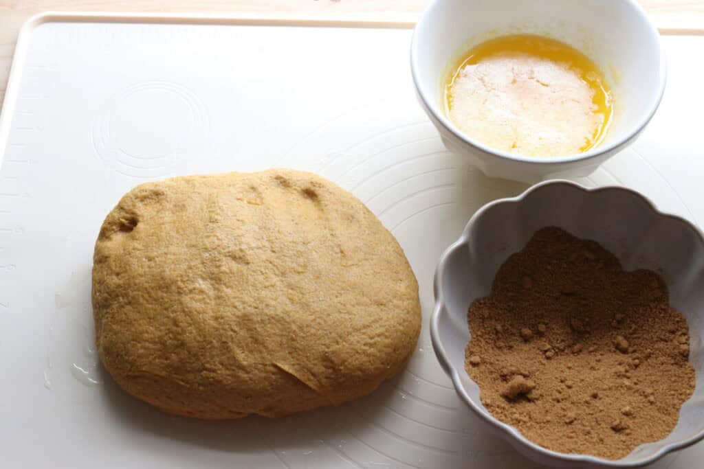melted butter, fresh milled pumpkin dough and cinnamon sugar to make fresh milled pumpkin monkey bread