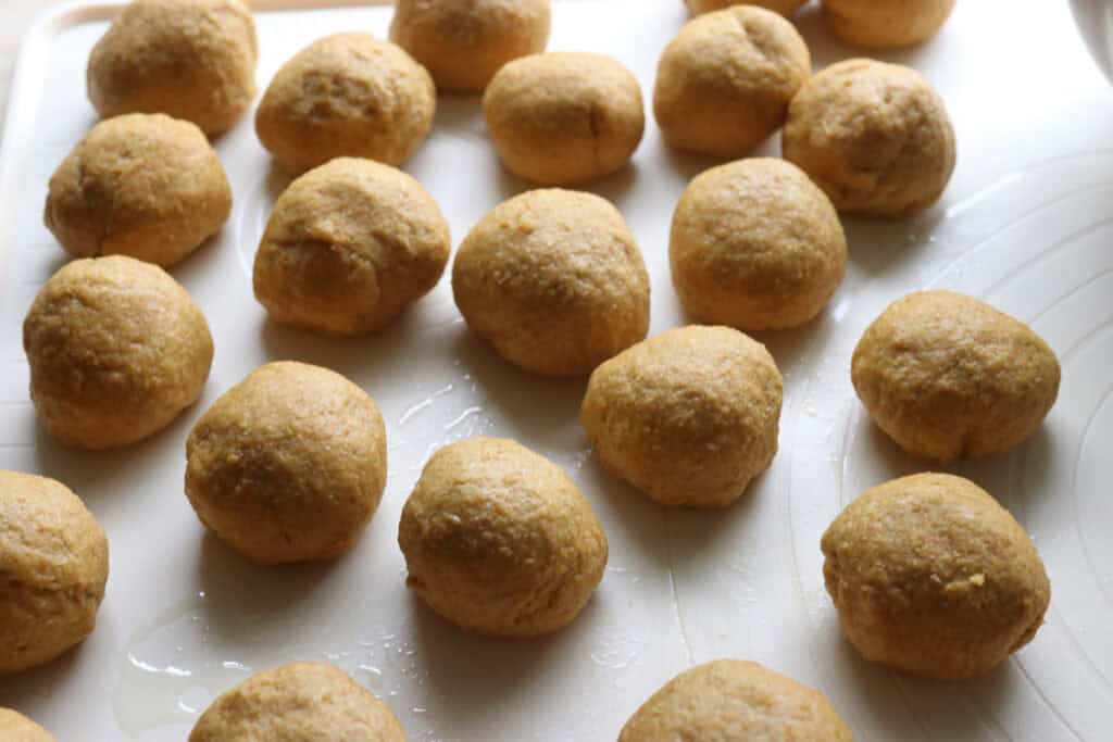 fresh milled pumpkin monkey bread that has been rolled into balls