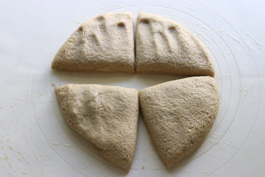 the dough for freshly milled parmesan pesto star bread cut into 4 pieces